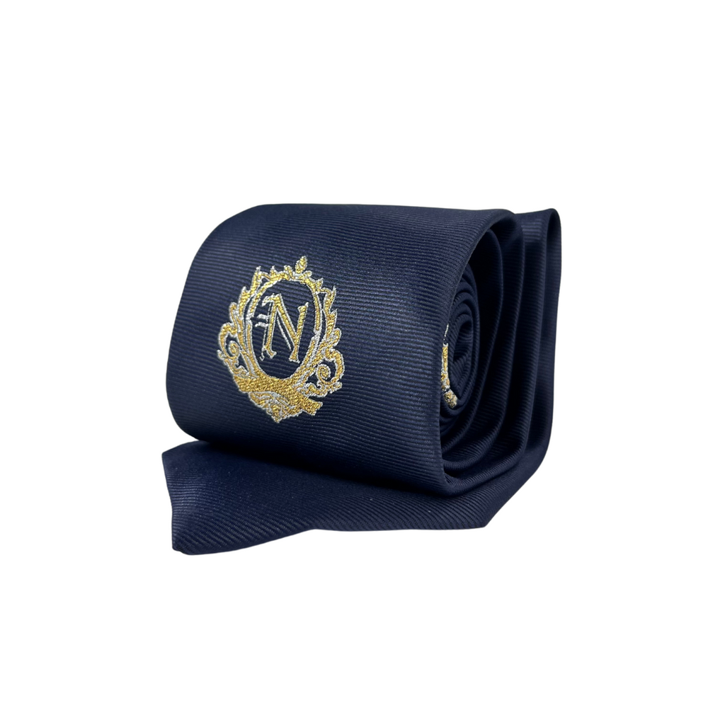 Corbata azul marino con escudo bordado